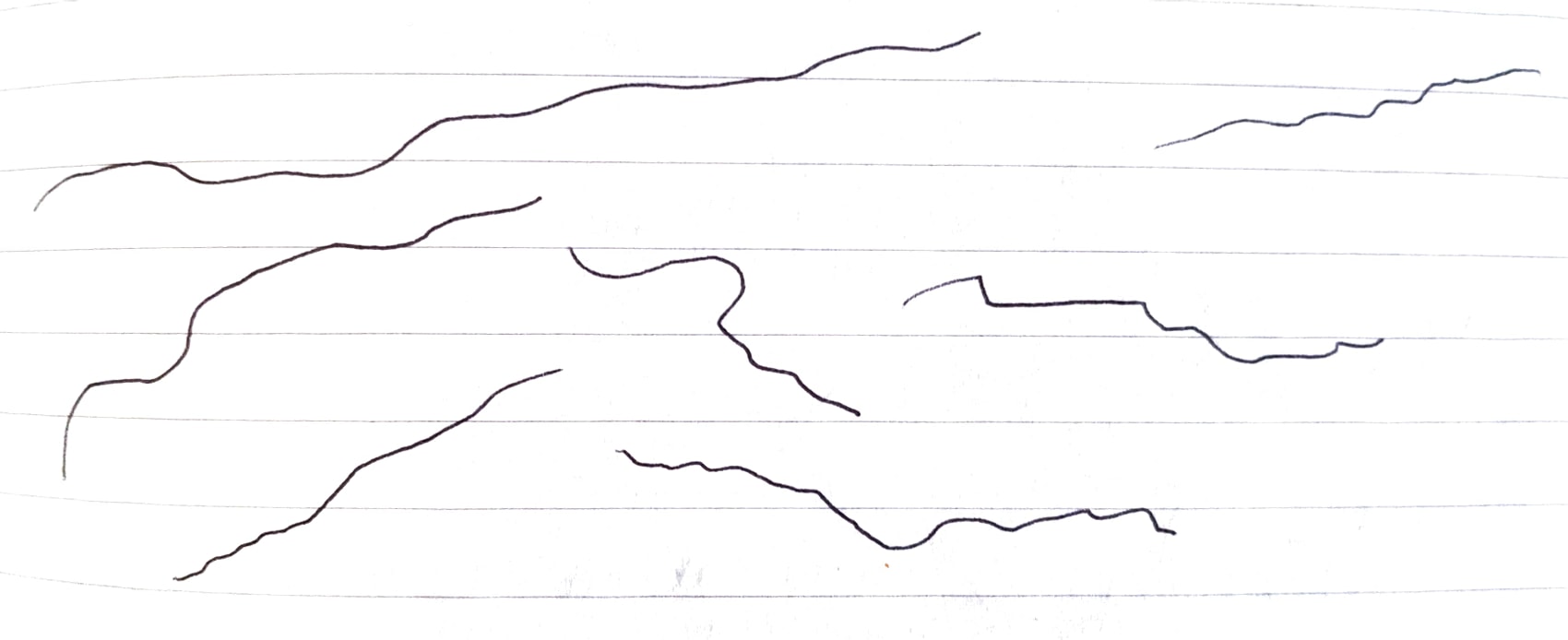 Wobbly thin pen lines drawn on lined paper